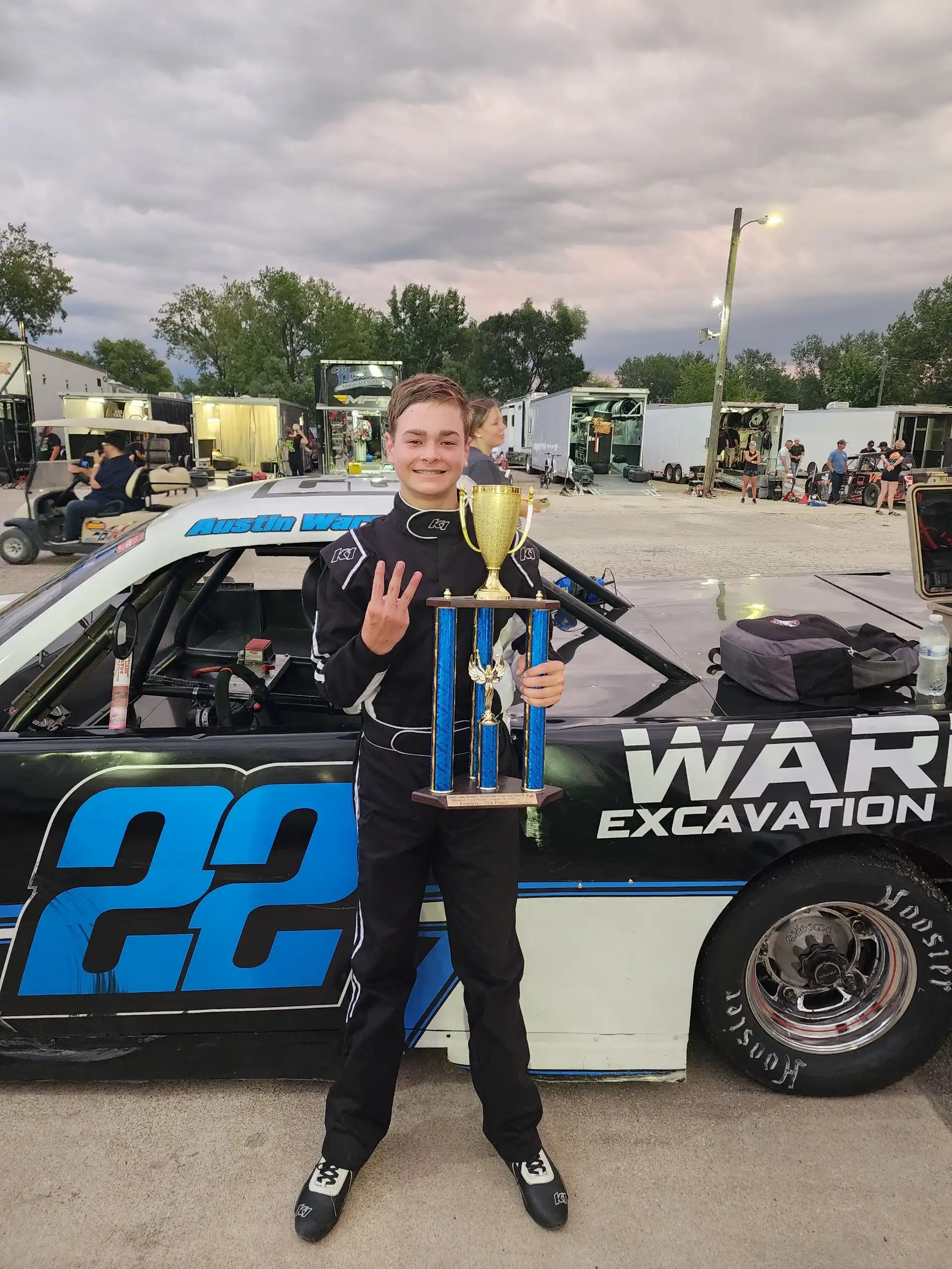 Austin Warner holding a trophy